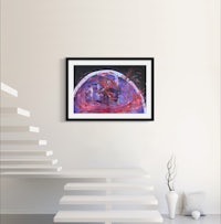 a framed print of an abstract painting on a wall